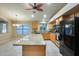 Beautiful kitchen featuring granite island, stainless appliances, and ample cabinet space at 22852 N 103Rd Ave, Peoria, AZ 85383