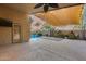 Covered patio with sunshade, outdoor pool and desert landscaping at 22852 N 103Rd Ave, Peoria, AZ 85383