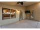 Covered patio with dual screen doors, a mounted television and backyard view at 22852 N 103Rd Ave, Peoria, AZ 85383