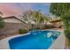 Sparkling pool with waterfall, landscaped surroundings, and a tranquil setting at 22852 N 103Rd Ave, Peoria, AZ 85383