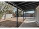 Covered patio and gravel backyard with block wall at 2371 E Larkspur Dr, Phoenix, AZ 85022