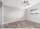 Light-filled bedroom with wood-look floors and barn door at 2371 E Larkspur Dr, Phoenix, AZ 85022