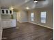 Open living room and kitchen with hardwood floors at 2787 W Cactus Wren St, Apache Junction, AZ 85120