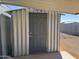 Metal storage shed with a gray door in the backyard at 2787 W Cactus Wren St, Apache Junction, AZ 85120