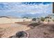 Landscaped backyard with fire pit and storage shed at 2796 E Inca Ln, San Tan Valley, AZ 85140