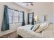 Spacious bedroom with large windows and a queen bed at 2796 E Inca Ln, San Tan Valley, AZ 85140