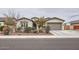 Single story home with a two-car garage and well manicured front yard at 2796 E Inca Ln, San Tan Valley, AZ 85140