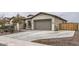 Attached two-car garage with a long driveway at 2796 E Inca Ln, San Tan Valley, AZ 85140