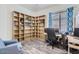Bright home office with built-in shelving and hardwood floors at 2796 E Inca Ln, San Tan Valley, AZ 85140