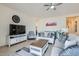 Living room with comfortable seating, a large TV, and a cozy atmosphere at 2796 E Inca Ln, San Tan Valley, AZ 85140