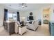 Bright living room with sofas, a TV, and sliding glass doors to the backyard at 2796 E Inca Ln, San Tan Valley, AZ 85140