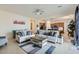 Spacious living room with light-colored furniture and a view into the kitchen at 2796 E Inca Ln, San Tan Valley, AZ 85140