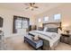 Spacious Primary bedroom with a king-size bed and sitting area at 2796 E Inca Ln, San Tan Valley, AZ 85140
