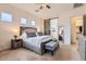 Large Primary bedroom with sliding barn door to bathroom at 2796 E Inca Ln, San Tan Valley, AZ 85140