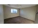 Well-lit bedroom featuring a window and ceiling fan at 3020 N 52Nd Pkwy, Phoenix, AZ 85031