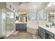 Bathroom featuring dual sinks, a walk-in shower, a soaking tub, and wood-look floors at 3095 S Ironwood St, Gilbert, AZ 85295