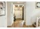 Elegant foyer featuring hardwood floors, coffered ceiling, a decorative light fixture and an arched doorway at 3095 S Ironwood St, Gilbert, AZ 85295