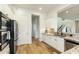 Kitchen area featuring stainless appliances, white cabinets and granite counters, plus hardwood floors throughout at 3095 S Ironwood St, Gilbert, AZ 85295