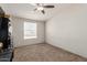 Spacious bedroom with carpeted floors and large window at 3315 N Datura Ct, Maricopa, AZ 85139