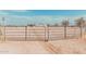 Metal gate entrance to property with large yard at 3315 N Datura Ct, Maricopa, AZ 85139