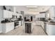 Spacious kitchen with island, stainless steel appliances, and white cabinets at 3315 N Datura Ct, Maricopa, AZ 85139