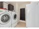 Laundry room with washer, dryer, and extra refrigerator at 3315 N Datura Ct, Maricopa, AZ 85139
