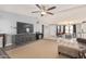 Open concept living room with a TV and seating area at 3315 N Datura Ct, Maricopa, AZ 85139