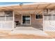 Covered patio with seating area, adjacent to the house at 3315 N Datura Ct, Maricopa, AZ 85139