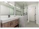 Modern bathroom with marble vanity, glass enclosed shower and stylish fixtures at 338 E Elm St, Phoenix, AZ 85012