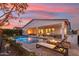 Relaxing pool area with lounge chairs and a beautiful sunset view at 3891 W Talc Dr, San Tan Valley, AZ 85144