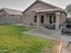 Landscaped backyard with patio and grassy area at 4330 E South Fork Dr, Phoenix, AZ 85044