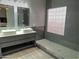 Modern bathroom with double sinks, large shower, and tile floor at 4330 E South Fork Dr, Phoenix, AZ 85044