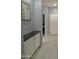 Hallway with built-in storage and dark flooring at 4330 E South Fork Dr, Phoenix, AZ 85044