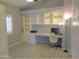 Home office with built-in shelving and hardwood floors at 4330 E South Fork Dr, Phoenix, AZ 85044
