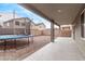 Covered patio, backyard with trampoline at 44230 W Palmen Dr, Maricopa, AZ 85138