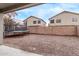 Large gravel backyard with a trampoline and a block wall at 44230 W Palmen Dr, Maricopa, AZ 85138