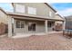 Backyard view with covered patio and trampoline at 44230 W Palmen Dr, Maricopa, AZ 85138