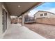 Covered patio, backyard with trampoline at 44230 W Palmen Dr, Maricopa, AZ 85138