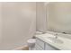 Simple half bathroom with a toilet and sink at 44230 W Palmen Dr, Maricopa, AZ 85138