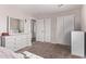 Bedroom with large mirror and closet at 44230 W Palmen Dr, Maricopa, AZ 85138