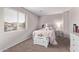 Bright bedroom with window, carpet, and built-in storage at 44230 W Palmen Dr, Maricopa, AZ 85138