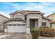 Two-story house with a two-car garage and landscaping at 44230 W Palmen Dr, Maricopa, AZ 85138