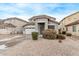 Two-story house with a two-car garage and desert landscaping at 44230 W Palmen Dr, Maricopa, AZ 85138