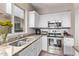 Well-equipped kitchen with stainless steel appliances and granite counters at 44230 W Palmen Dr, Maricopa, AZ 85138