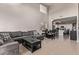 Open concept living and dining area with high ceilings and kitchen view at 44230 W Palmen Dr, Maricopa, AZ 85138