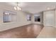 Living room with tile floors and neutral color palette at 44230 W Palmen Dr, Maricopa, AZ 85138
