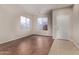 Living room with tile floors and large windows at 44230 W Palmen Dr, Maricopa, AZ 85138