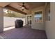 Cozy covered patio with ceiling fan and outdoor grill, perfect for entertaining at 44520 W Windrose Dr, Maricopa, AZ 85138