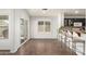 Bright dining area with sliding glass door, shuttered windows, and bar seating at 44520 W Windrose Dr, Maricopa, AZ 85138