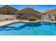 Inviting swimming pool in a fenced backyard, perfect for relaxation and outdoor enjoyment at 44520 W Windrose Dr, Maricopa, AZ 85138